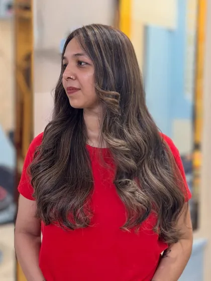 This client's Toffee hair color looks stunning from every angle, with soft waves that show off the beautiful blend.