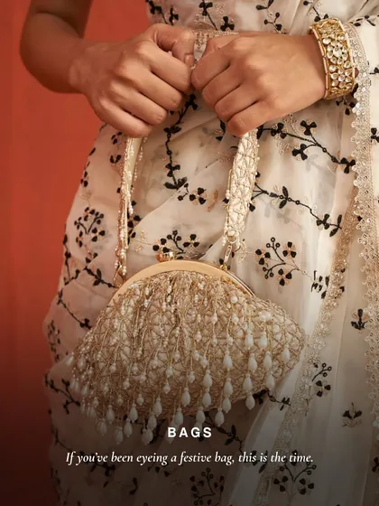 If you have been eyeing a festive bag, this is the time. This image captures the delicate beauty of my pearl-tasseled clutch, a perfect accessory to complement an elegant, embroidered outfit.