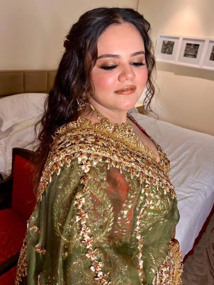 Another angle of the curly half updo. This style is perfect for a bride who wants a relaxed yet beautiful look for her pre wedding functions.