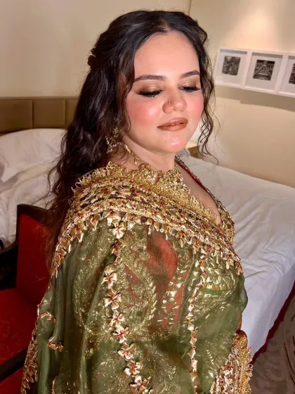 Another angle of the curly half updo. This style is perfect for a bride who wants a relaxed yet beautiful look for her pre wedding functions.