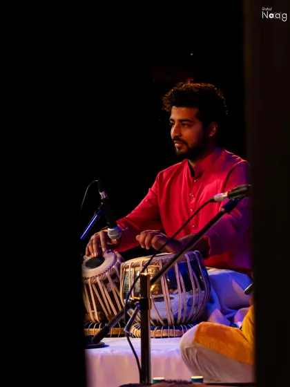 A focused moment during the Debadhara Festival, captured from the wings of the stage.