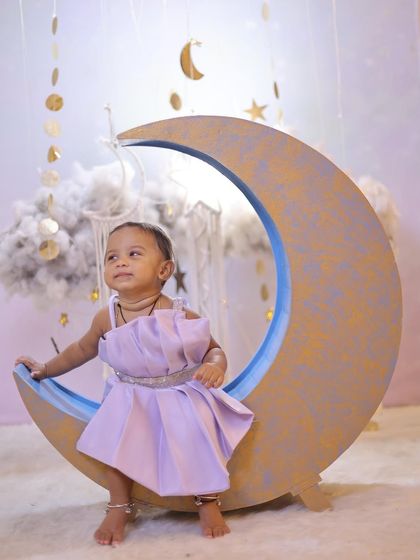 This series shows different angles and poses on our popular crescent moon prop. The set is versatile, allowing for sitting, reaching, and looking-up shots against the starry sky.