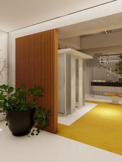 A waiting area or foyer with a tree mural, a simple wooden bench, and a view into the central courtyard. This space serves as a calm and welcoming entry point to the home.