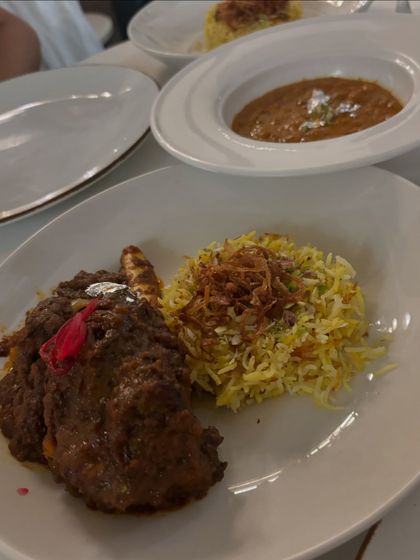 A main course from our tasting menu: Nawabi Pyaz Gosht served with aromatic Saffron Kewda Rice and a side of Sultani Dal. A truly royal feast.