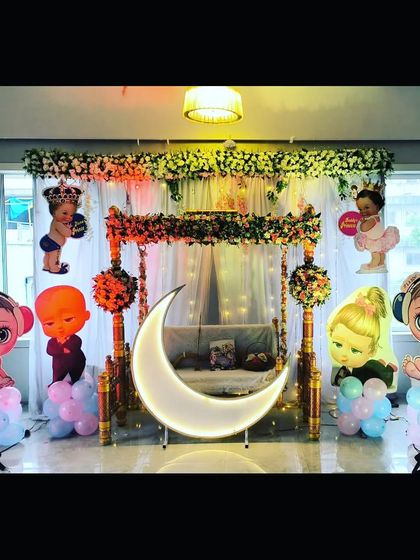 The baby shower setup in bright, even lighting, showcasing all the different characters and decorative elements clearly.