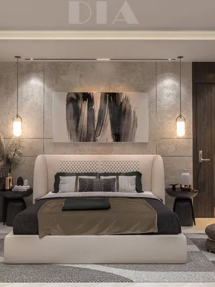 This bedroom design uses a neutral color palette and a variety of textures to create a calming retreat. The concrete-finish wall panels and low-hanging pendant lights add a touch of industrial chic to the comfortable space.