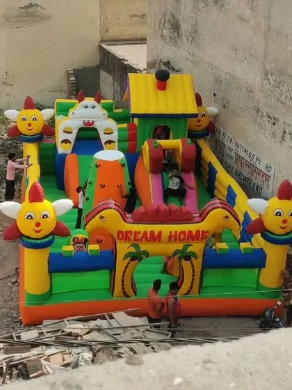 An aerial view of our "Dream Home" inflatable combo, showing the internal layout with slides and play areas. This is a great option for amusement parks.