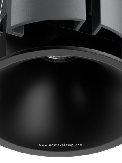 A product shot of our downlight featuring a matte black reflector and trim. This option is ideal for creating a more dramatic lighting effect, as the black finish absorbs stray light and provides a highly focused, low-glare beam.