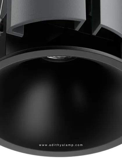 A product shot of our downlight featuring a matte black reflector and trim. This option is ideal for creating a more dramatic lighting effect, as the black finish absorbs stray light and provides a highly focused, low-glare beam.