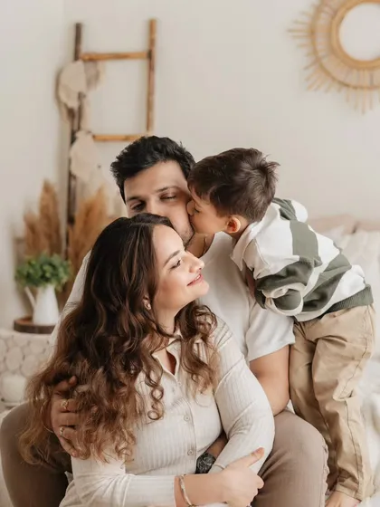 A sweet kiss from a loving son. I love capturing these unscripted moments of affection between children and their parents during our lifestyle family shoots.