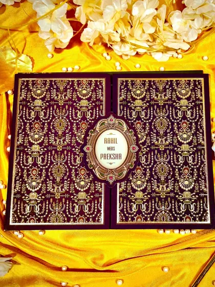 The epitome of luxury, this gate-fold card is covered in a deep purple brocade pattern with intricate gold foil, creating a rich, tactile experience.
