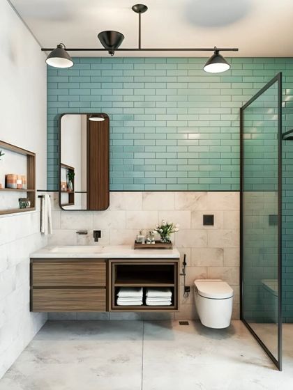 A bathroom with a mix of textures, featuring a floating wood vanity, a marble-tiled wall, and a striking turquoise subway tile accent. The design is fresh, modern, and unique.