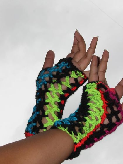 For a bolder look, check out these edgy fingerless gloves made with neon variegated yarn. Each pair is unique because of the way the colors change in the yarn.
