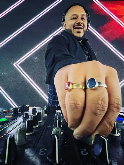 Happy Lohri. A creative shot of my hand on the mixer, with my custom rings and a vibrant background, capturing the festive spirit.