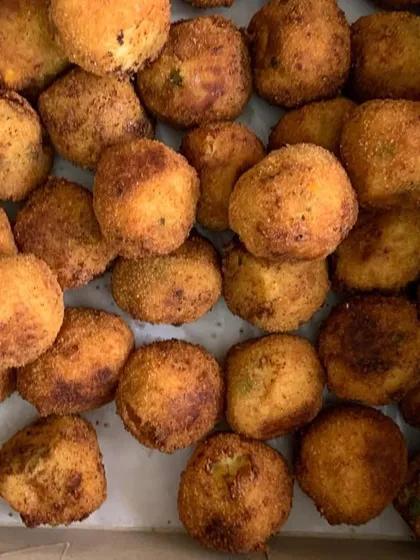 A box of crispy corn and cheese balls.