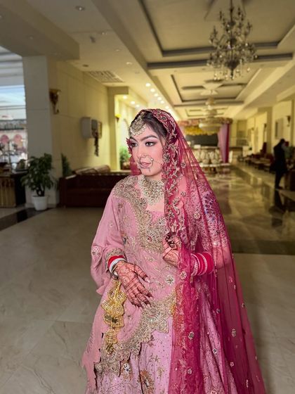 The full bridal look. Jasleen's pastel outfit is paired with soft, romantic makeup for a cohesive and elegant appearance.