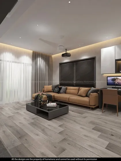 The same home theatre space, showing the comfortable leather sofa and the integrated computer desk, making it a multi-functional entertainment room.