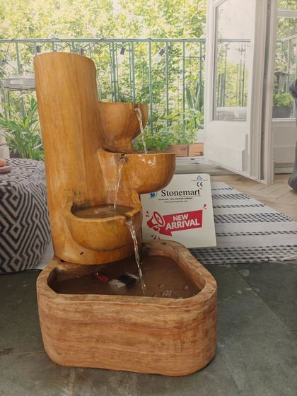 The 32-inch cascading fountain is a substantial piece, yet its design feels organic and fits well within a garden or patio setting.