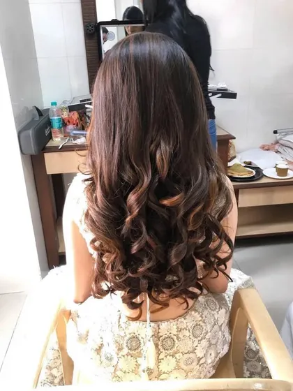 Another view of the defined curls, showing the consistency and finish I achieve for open hairstyles. This is a great option for party or event styling.