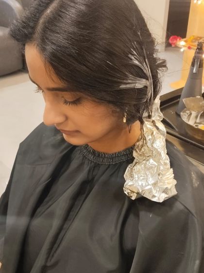 The colouring process begins. Here, I'm applying foils to create precise highlights, ensuring a flawless and natural-looking blend.