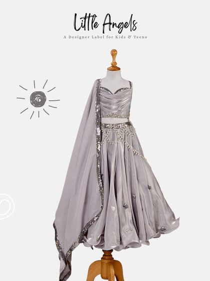 Formal fashion for our little stars. A grey lehenga with sequin work displayed on a mannequin.