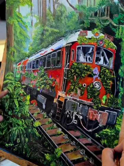 Another angle of the gouache painting, showing the artist adding fine details. This medium is versatile and great for illustration-style paintings.