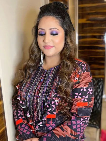 A close-up of the purple smokey eye. The color is playful yet elegant, perfect for a happy celebration.