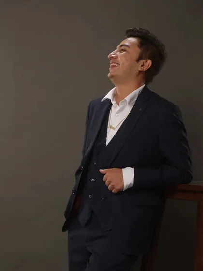 Looking up with a smile. I am always optimistic and bring that positive energy to my work.