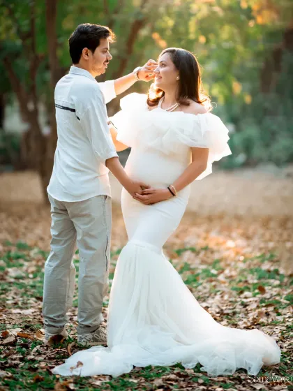A sweet, candid moment during an outdoor shoot, as he gently brushes her hair from her face. It's these small gestures that tell the biggest love stories.