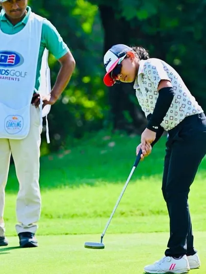 Aahana Shrivastava in action, focusing on a crucial putt during the US Kids New Delhi Fall Local Tour.