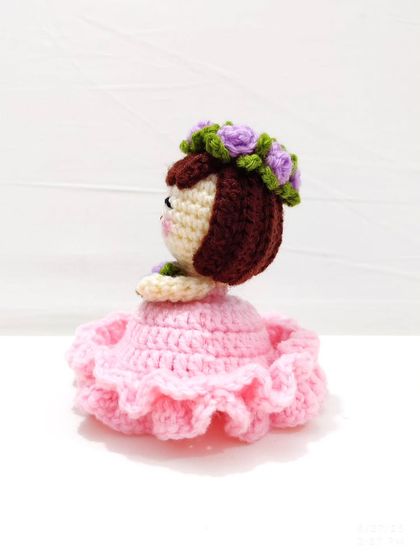 This reversible bouquet doll is two gifts in one. It starts as a beautiful floral bouquet and flips inside out to reveal an adorable doll in a pink frilly dress with a flower crown.