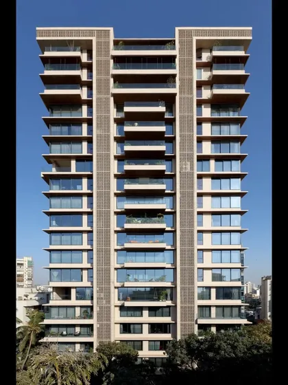 The completed facade of our residential project on Pali Hill, Mumbai. The design uses clean vertical lines and expansive glass panels to create a modern and sophisticated aesthetic that complements its upscale urban surroundings.