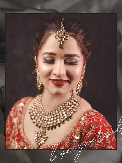 A serene and beautiful portrait of a bride with her eyes closed, showcasing her flawless makeup and stunning Kundan jewelry. This shot is all about quiet elegance.