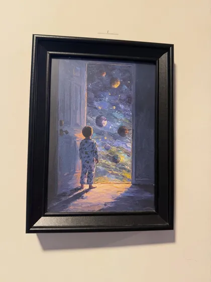 This artwork, showing a child opening a door to the universe, symbolizes our goal to open up a world of imagination for our students.