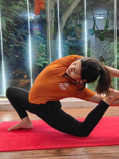 This twisted lizard pose variation requires deep hip opening and spinal rotation.