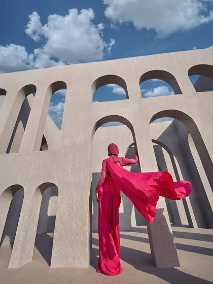A pink pre-draped sari featuring a corset bodice and delicate mesh details, lifted with dazzling embellishments. It is the perfect blend of tradition and modern allure.