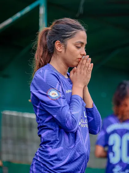 A moment of quiet focus and prayer before the game. Mental preparation is just as important as physical training.