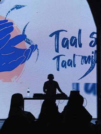A silhouette of me against my custom 'Taal se Taal mila' visuals. This shot perfectly captures my philosophy: mixing beats and visuals to get everyone in sync on the dancefloor.