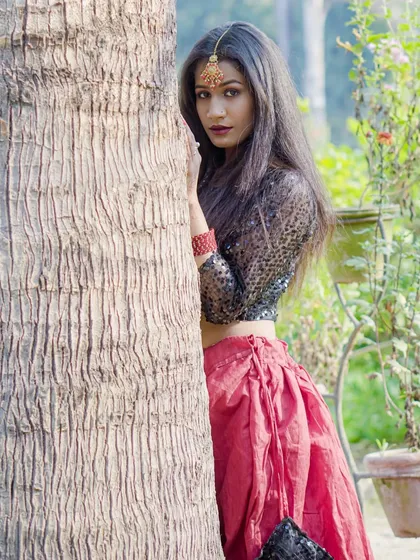 A vertical full-body shot that captures the complete outfit and pose. This is essential for a model's portfolio to show their presence and style.