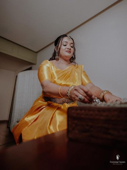 A candid shot of the bride getting ready for her engagement, capturing her natural beauty and excitement.