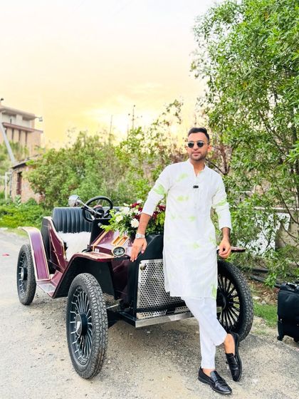 Ready to lead the procession. Whether it's in a vintage car or on a high-tech truck, I make sure the groom's baraat is an event to remember.
