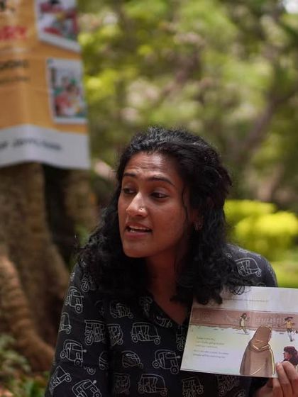 Reading the book 'Goal' and discussing it with the children. These moments of interaction are crucial for building comprehension and critical thinking.