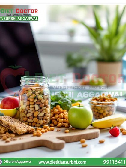 Keeping healthy snacks like nuts, fruits, and roasted chickpeas at your desk is a simple strategy to avoid unhealthy cravings and maintain energy levels during a busy workday.