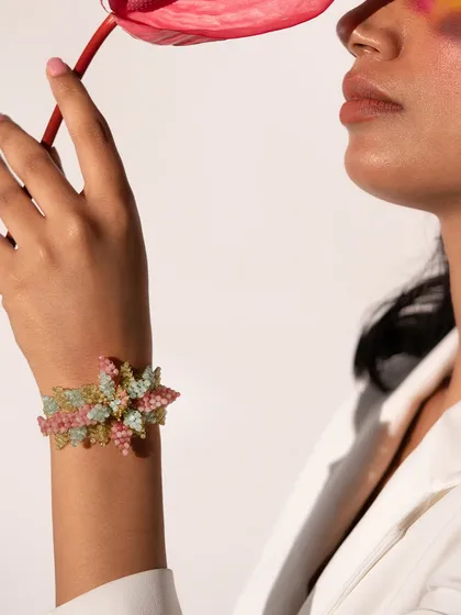 This colourful beaded bracelet is a beautiful statement piece, perfect for adding a pop of colour to a simple outfit.