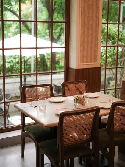 Our cafes are designed to be your comfortable escape. Tucked inside beautiful lifestyle stores, each location offers a serene, elegant setting with large windows that look out onto lush greenery, perfect for a quiet meal or a coffee break.