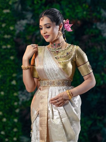 A close-up showing the delicate makeup and jewelry that perfectly accessorize the outfit.