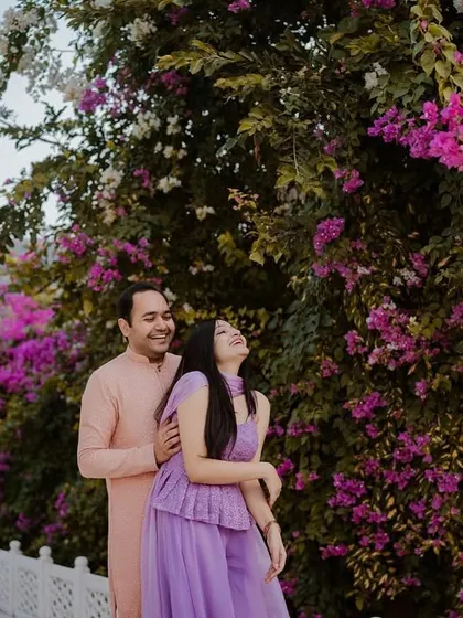 Laughter and love amidst a riot of bougainvillea. We believe in finding spots of natural beauty within historical sites to add color and life to your royal pre-wedding photoshoot.