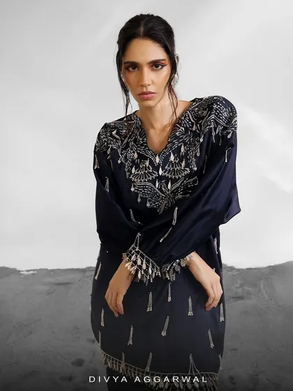 The Orion Kaftan Set in a deep navy blue, offering a dramatic and sophisticated alternative. The silver embellishments stand out beautifully against the dark fabric.