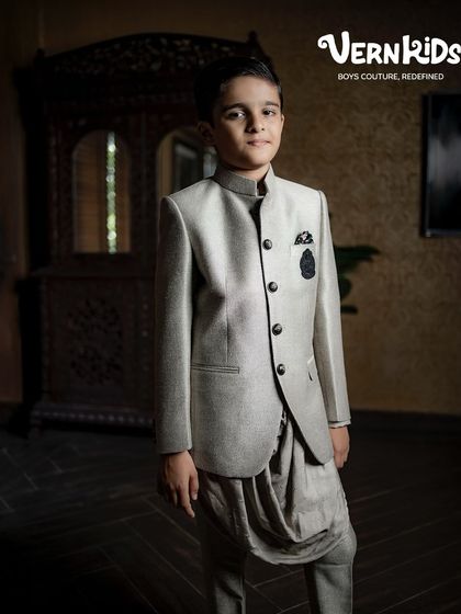 A full view of our grey Jodhpuri set, showing how the jacket and dhoti pants create a cohesive and stylish ensemble. It’s a testament to our belief that boys' wear can be both traditional and fashion-forward.
