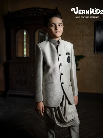 A full view of our grey Jodhpuri set, showing how the jacket and dhoti pants create a cohesive and stylish ensemble. It’s a testament to our belief that boys' wear can be both traditional and fashion-forward.